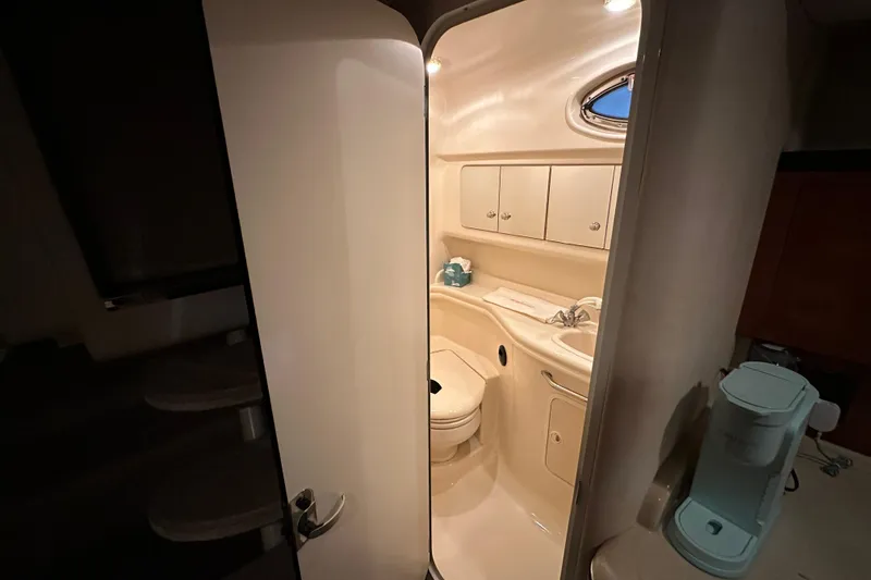 Slide: The Image of Interior view of 2004 Sea Ray 340 Sundancer bathroom with modern amenities. - 50