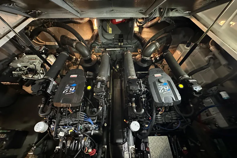 Slide: The Image of Engine room of a 2004 Sea Ray 340 Sundancer with twin MerCruiser 6.2L engines. - 54
