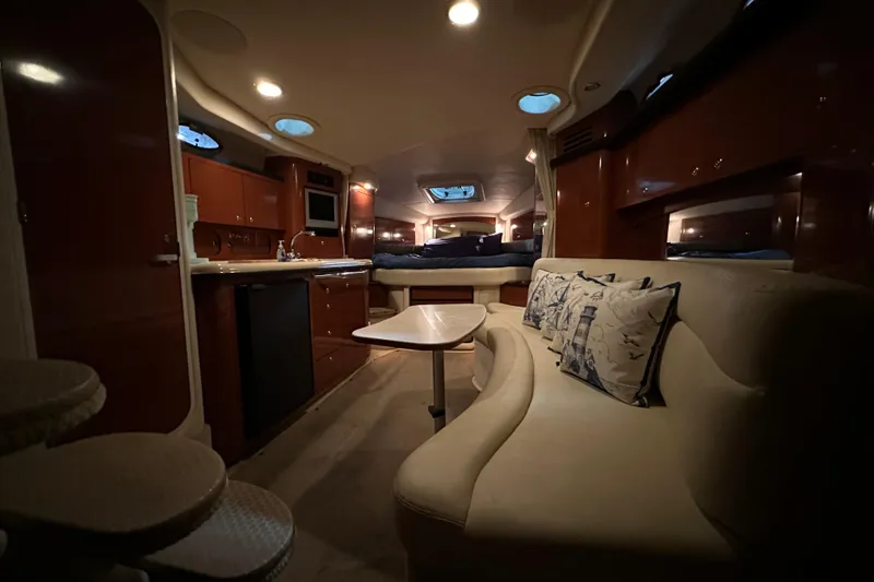 Slide: The Image of Luxurious interior of 2004 Sea Ray 340 Sundancer yacht with cozy seating and elegant wood finishes. - 63