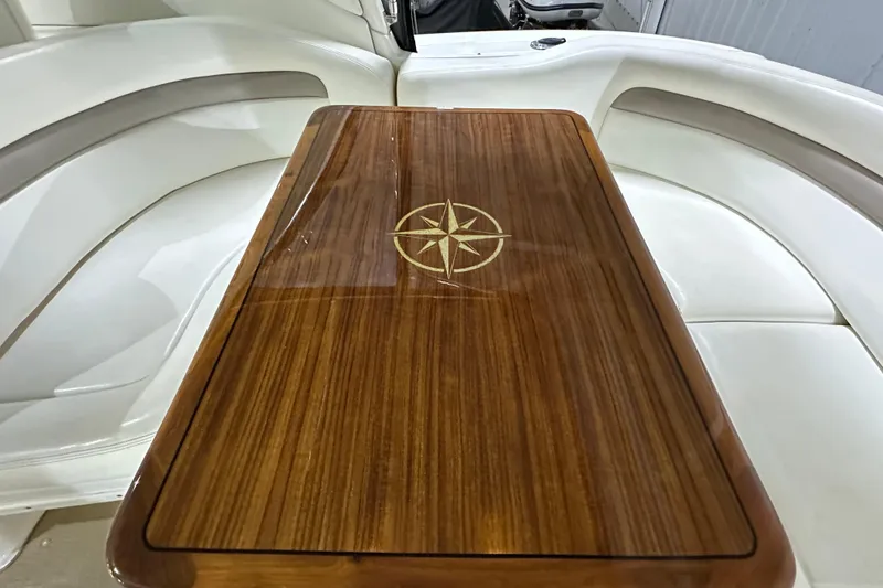 Slide: The Image of Luxurious wooden table with compass design on 2004 Sea Ray 340 Sundancer boat. - 8