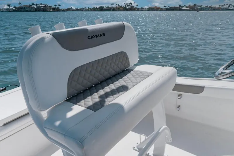 Slide: The Image of 2026 Caymas 24 HB boat seat with quilted design on a sunny day. - 8