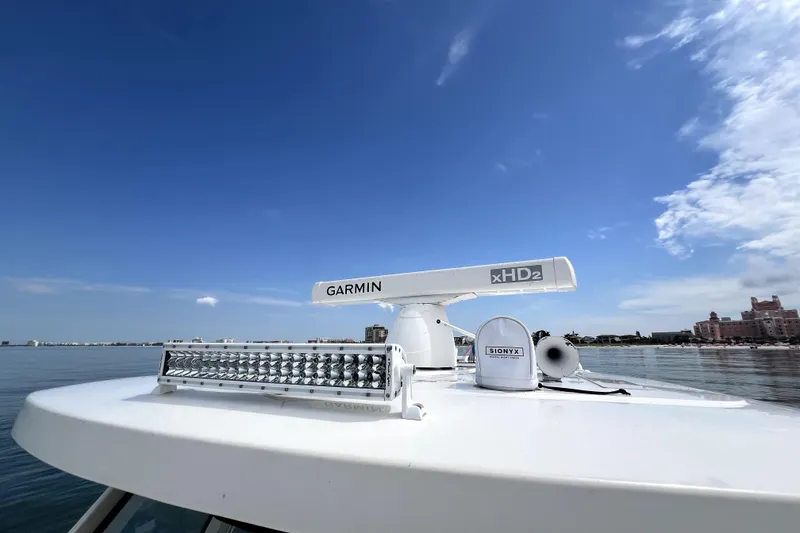 Slide: The Image of 2020 Pursuit S 328 Sport boat with Garmin xHD2 radar and SIONYX camera under clear sky. - 21