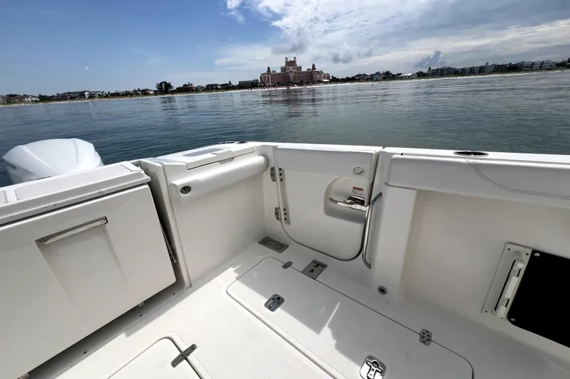 Slide: The Image of 2020 Pursuit S 328 Sport boat interior with scenic waterfront view. - 5