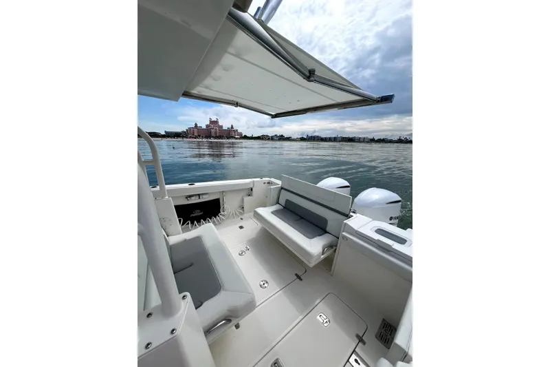 Slide: The Image of 2020 Pursuit S 328 Sport boat interior with scenic waterfront view. - 9