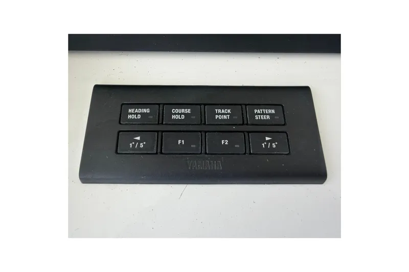 Slide: The Image of Control panel with navigation buttons on a 2026 Regulator 37 boat. - 21