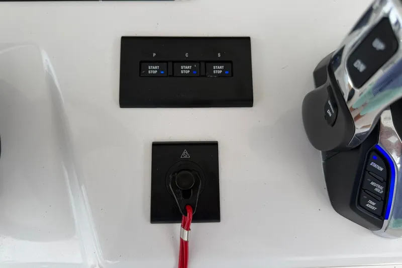 Slide: The Image of Control panel of a 2026 Regulator 37 boat with start/stop buttons and throttle. - 22