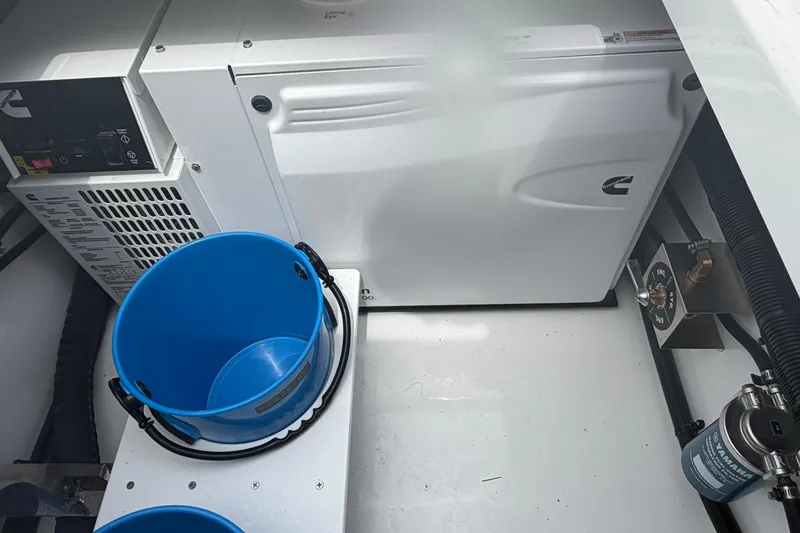 Slide: The Image of Engine compartment of 2026 Regulator 37 boat with blue bucket and Cummins equipment. - 26