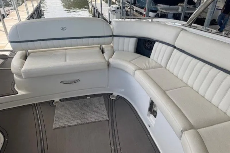 Slide: The Image of Luxurious seating area on a 2017 Cobalt R35 boat, docked by the water. - 10