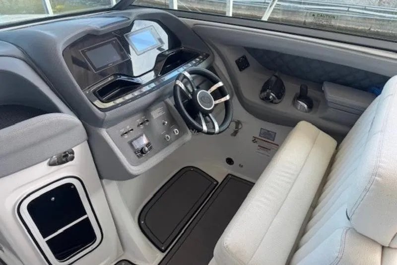 Slide: The Image of Cockpit of 2017 Cobalt R35 boat with modern steering and control panels. - 12