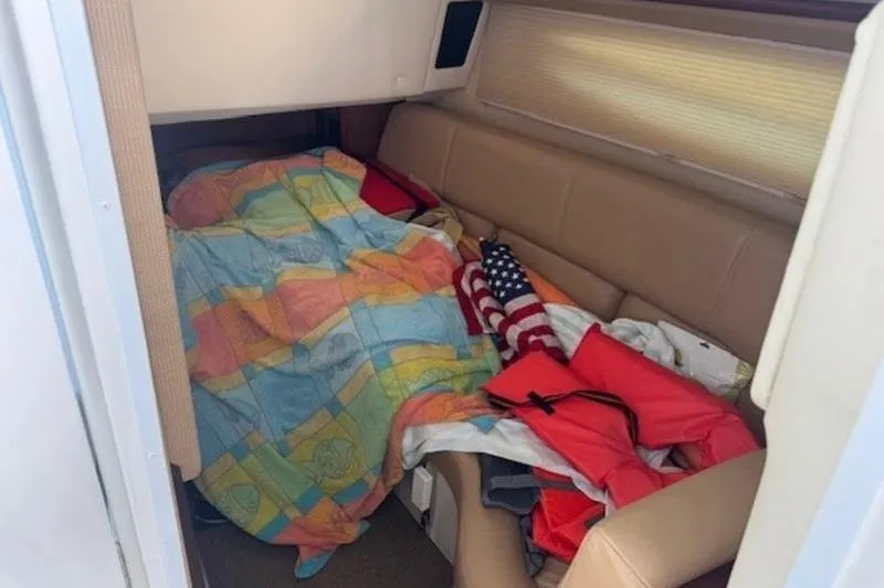Slide: The Image of Cozy cabin interior of 2017 Cobalt R35 with colorful blanket and American flag. - 13