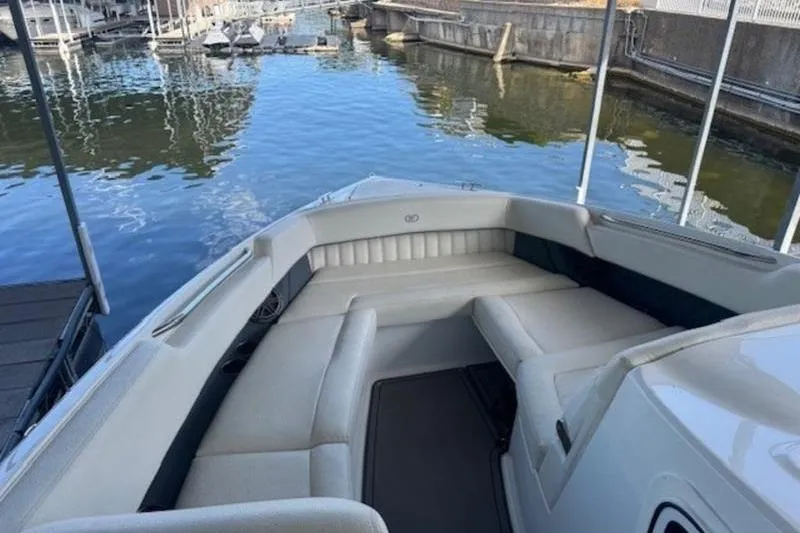 Slide: The Image of 2017 Cobalt R35 boat with spacious seating, docked by calm waters. - 16