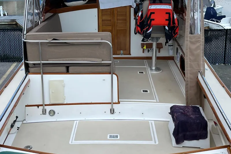 Slide: The Image of 2003 Dyer 29 Soft Top boat interior with seating and life jacket. - 15
