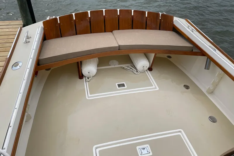 Slide: The Image of 2003 Dyer 29 Soft Top boat with cushioned seating and wooden accents. - 16