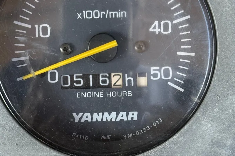Slide: The Image of Yanmar engine hour meter showing 5162 hours on a 2003 Dyer 29 Soft Top. - 32