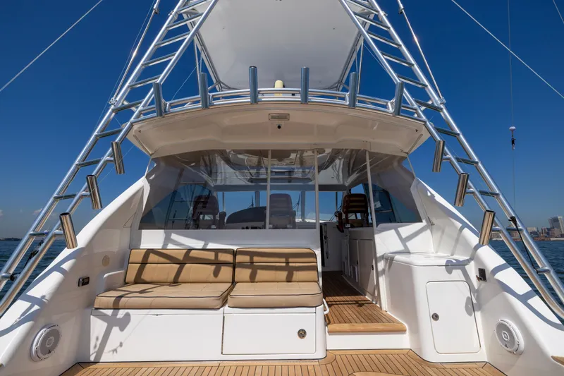 Slide: The Image of 2012 Cabo 44 Hardtop Express yacht with spacious deck and seating area. - 108