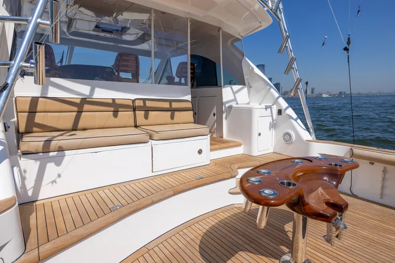 Slide: The Image of 2012 Cabo 44 Hardtop Express yacht deck with seating and ocean view. - 113