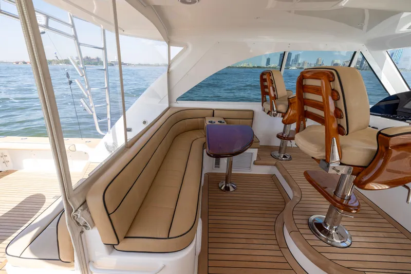Slide: The Image of 2012 Cabo 44 Hardtop Express yacht interior with luxurious seating and ocean view. - 131