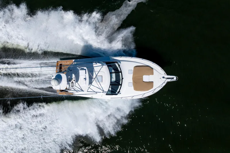 Slide: The Image of Overhead view of 2012 Cabo 44 Hardtop Express yacht cruising on water. - 23