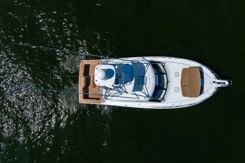 Slide: The Image of Overhead view of 2012 Cabo 44 Hardtop Express yacht cruising on water. - 58