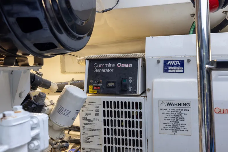 Slide: The Image of Seakeeper system with electrical hazard warning on 2012 Cabo 44 Hardtop Express. - 65