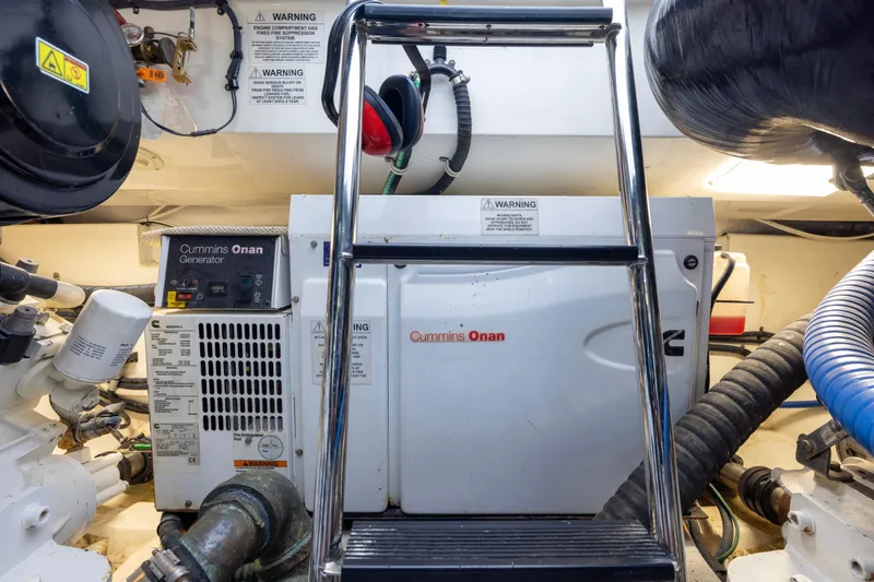 Slide: The Image of Engine room of 2012 Cabo 44 Hardtop Express with Cummins Onan generator. - 66