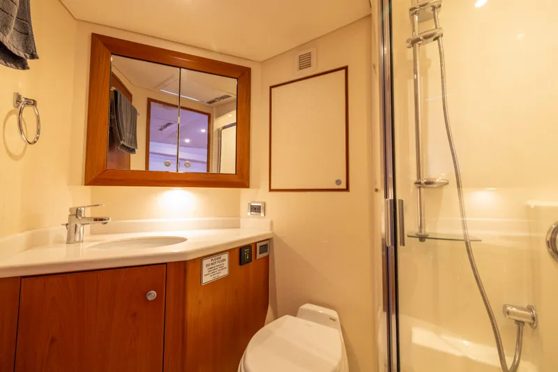 Slide: The Image of Luxurious bathroom in 2012 Cabo 44 Hardtop Express yacht with modern fixtures. - 80