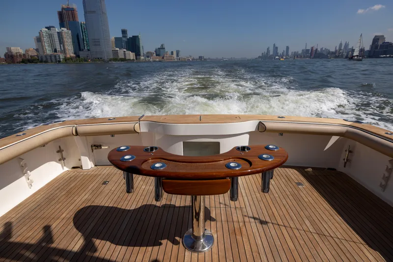 Slide: The Image of Luxurious interior of 2012 Cabo 44 Hardtop Express yacht with wood finishes and cozy seating. - 98