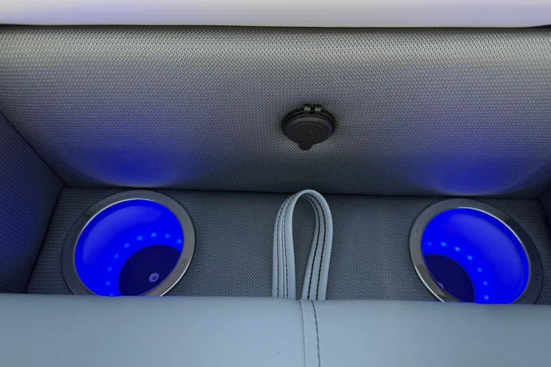 Slide: The Image of 2025 Bentley Pontoons Legacy 243 Swingback interior with illuminated cup holders. - 10