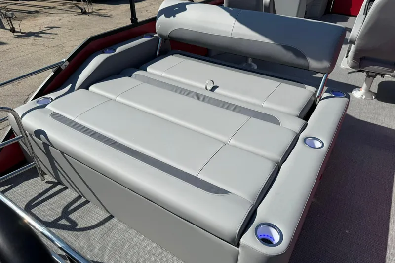 Slide: The Image of 2025 Bentley Pontoons Legacy 243 Swingback with luxurious seating and cup holders. - 14