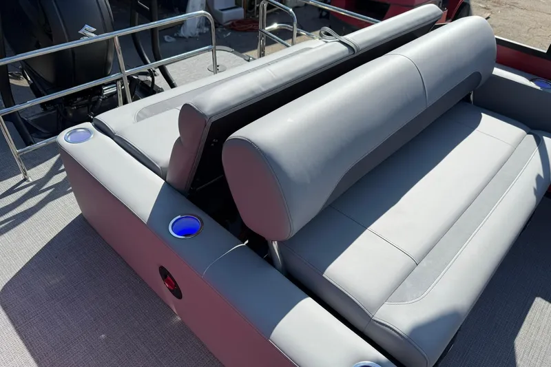 Slide: The Image of 2025 Bentley Pontoons Legacy 243 Swingback with luxurious gray seating and cup holders. - 15