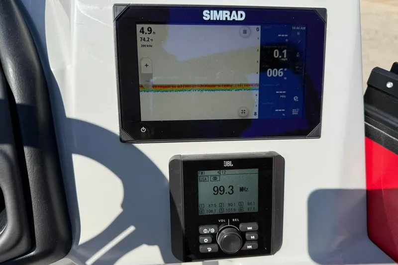 Slide: The Image of Simrad and JBL displays on 2025 Bentley Pontoons Legacy 243 Swingback dashboard. - 7