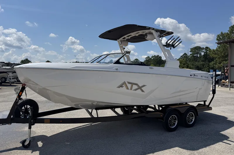 Slide: The Image of 2026 ATX Surf Boats 22 Type-S on trailer, parked outdoors under a clear sky. - 6