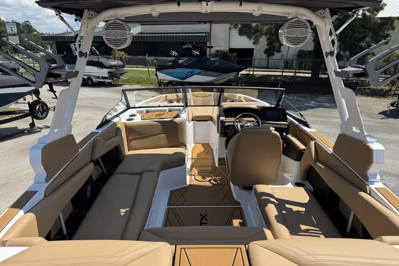 Slide: The Image of 2026 ATX Surf Boats 22 Type-S interior with tan seating and modern dashboard. - 7