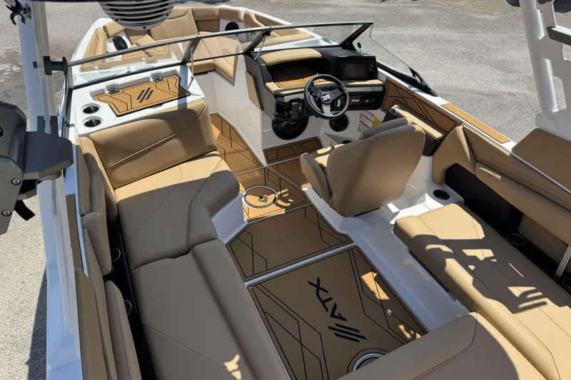 Slide: The Image of 2026 ATX Surf Boats 22 Type-S interior with tan seating and modern dashboard design. - 8