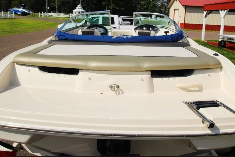 Slide: The Image of 2006 Sea Ray 205 Sport boat, rear view with swim platform and ladder. - 11