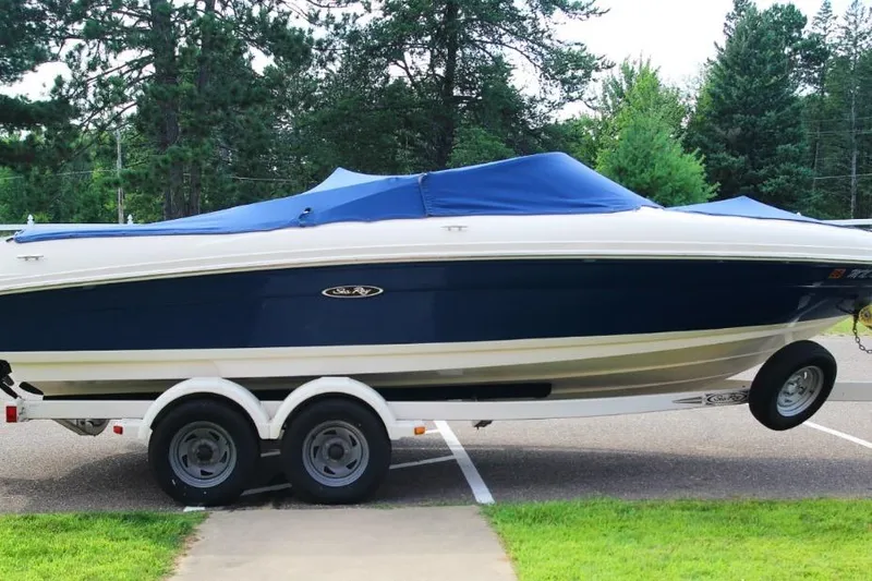 Slide: The Image of 2006 Sea Ray 205 Sport boat on trailer, covered, parked outdoors. - 3