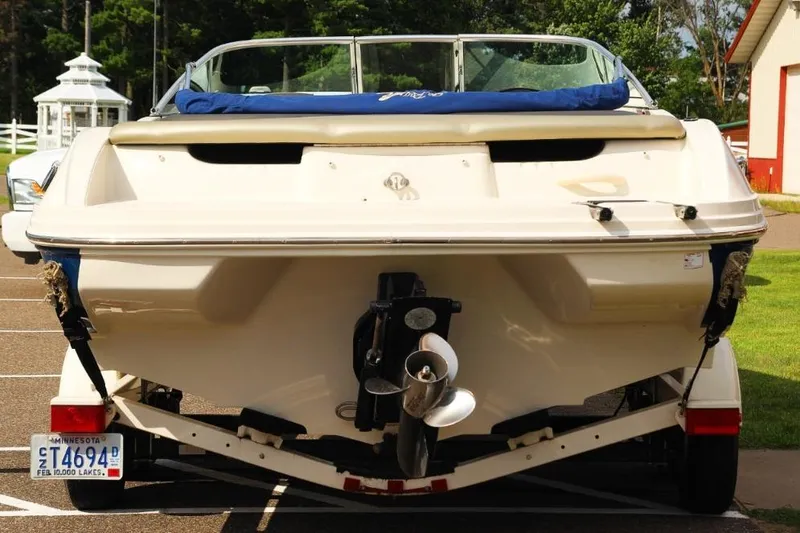 Slide: The Image of 2006 Sea Ray 205 Sport boat on trailer, rear view, parked outdoors. - 4