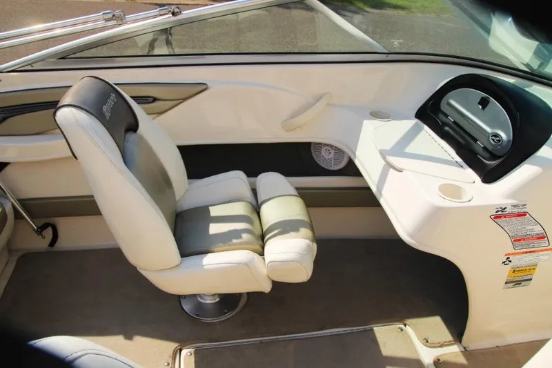 Slide: The Image of 2006 Sea Ray 205 Sport boat interior with seating and dashboard view. - 7
