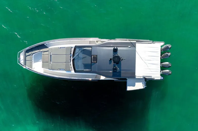 Slide: The Image of Top view of 2023 Azimut Verve 47 yacht on clear green water. - 10