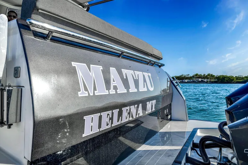 Slide: The Image of 2023 Azimut Verve 47 yacht on water, featuring sleek design and "MATZU" name. - 17