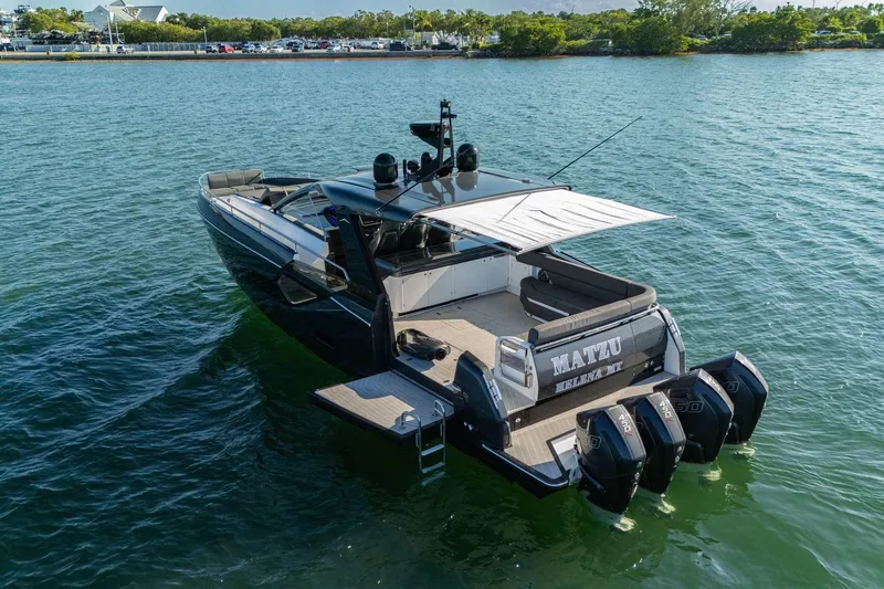 Slide: The Image of 2023 Azimut Verve 47 luxury yacht on water, featuring sleek design and powerful engines. - 2