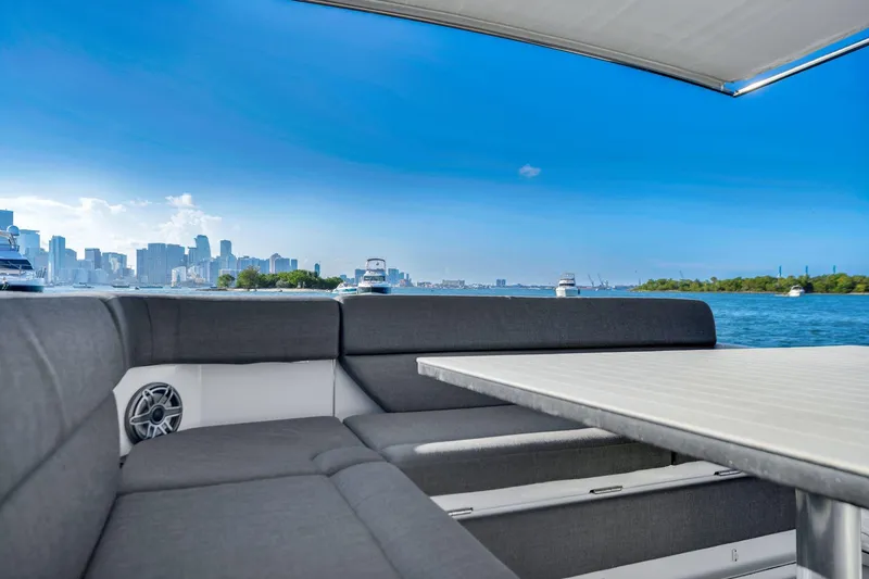 Slide: The Image of 2023 Azimut Verve 47 yacht interior with city skyline and ocean view. - 23