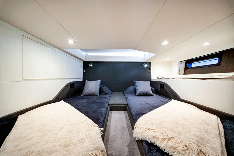 Slide: The Image of Luxurious cabin interior of 2023 Azimut Verve 47 yacht with twin beds and modern lighting. - 38