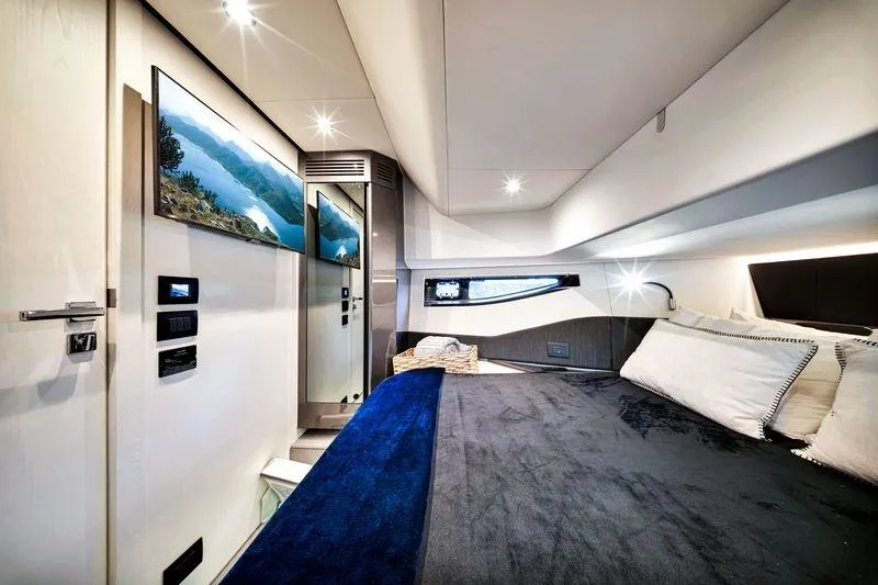Slide: The Image of Luxurious interior of 2023 Azimut Verve 47 yacht with modern design and cozy bedding. - 39