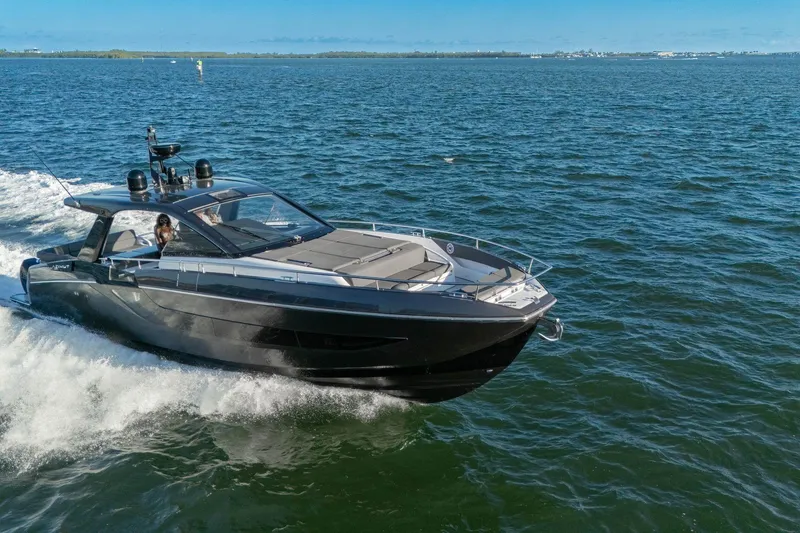 Slide: The Image of 2023 Azimut Verve 47 luxury yacht cruising on open water. - 4