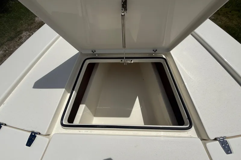Slide: The Image of Open storage compartment on 2026 Pathfinder 2300 HPS boat, showcasing interior space. - 37