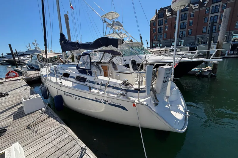 Slide: The Image of 2007 Bavaria Cruiser 33 sailboat docked at marina, sunny day, clear blue sky. - 24
