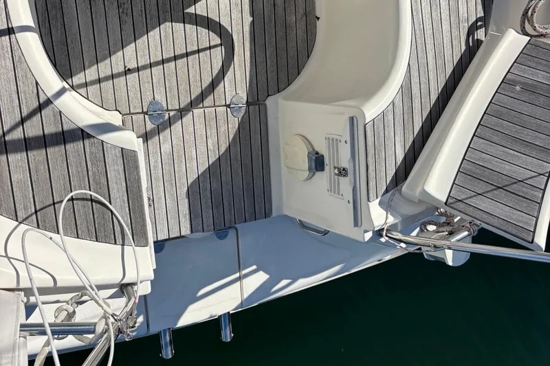 Slide: The Image of Deck of 2007 Bavaria Cruiser 33 sailboat with wooden finish and metal fittings. - 25