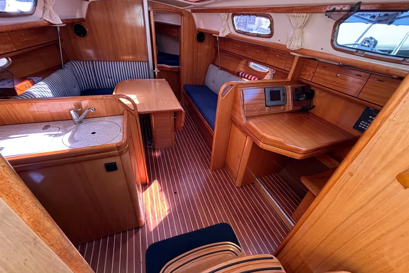 Slide: The Image of Interior of 2007 Bavaria Cruiser 33 yacht with wooden finish and cozy seating area. - 28
