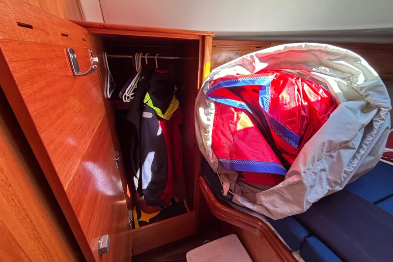 Slide: The Image of Interior of 2007 Bavaria Cruiser 33 sailboat with closet and colorful sail. - 36